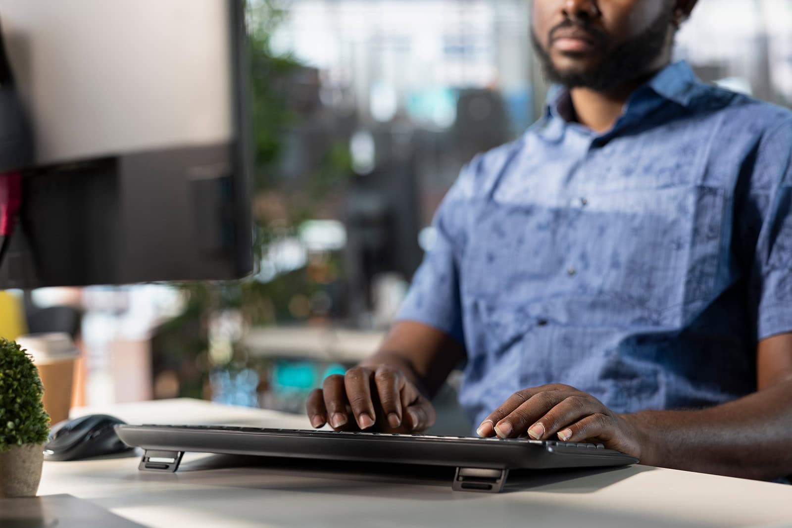 CPG Employer working on his computer
