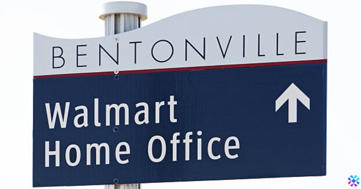 Walmart Home Office sign located in Bentonville, displaying the corporate logo and the name of the office.
